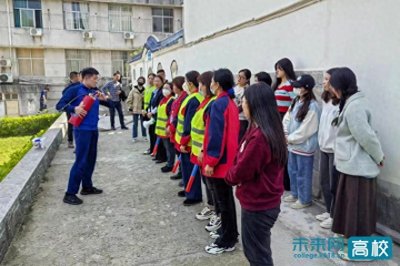 ​湖北民族大学在学生宿舍区开展消防应急疏散演练活动